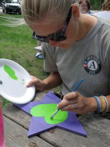 Rachel (Oak 3) paints a heart on her Star of HOPE