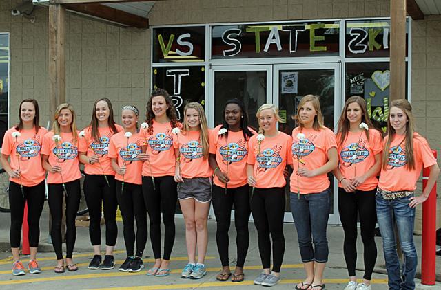 Vikette state track qualifiers met at Ehlinger's to paint windows before leaving for D.M.