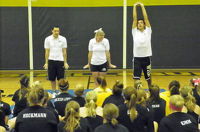 CSA instructors demonstrate the proper hand and arm positions for stunts during Cheerleading Camp.