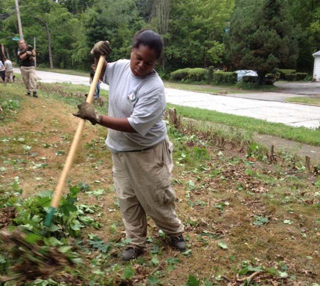 Oak 1 team member Jalesa clearing a vacant lot of branches in Youngstown, Ohio.
