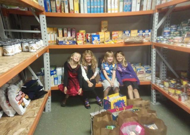 Girl Scouts provide Birthdays in Bags - Emma Lau, Lizzy Jeray, Ellery Johnson and Abby Davis.