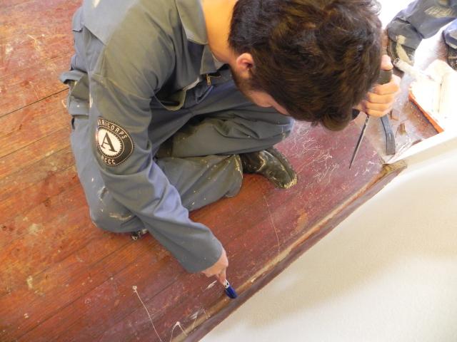 Kevin removing a base board.