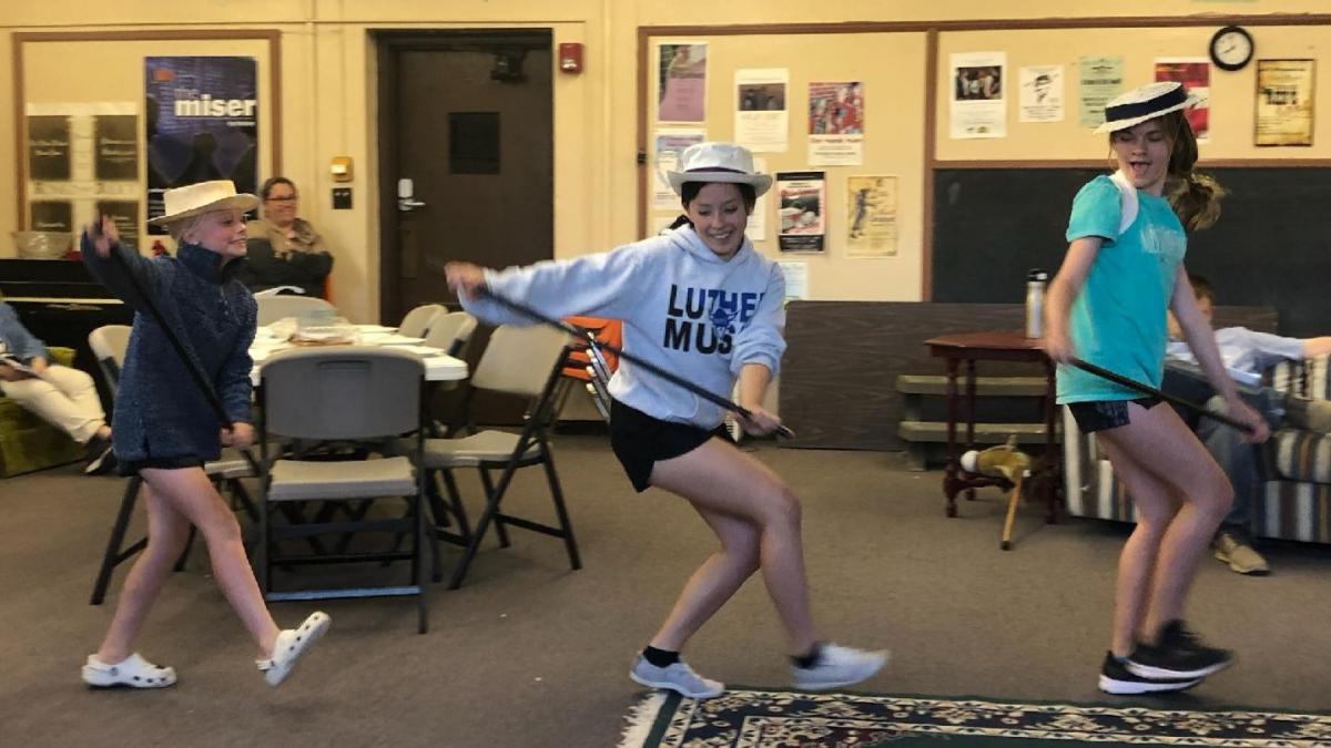 Lauren Hartkemeyer, Newelle Dalton, and Ellie Groom rehearse