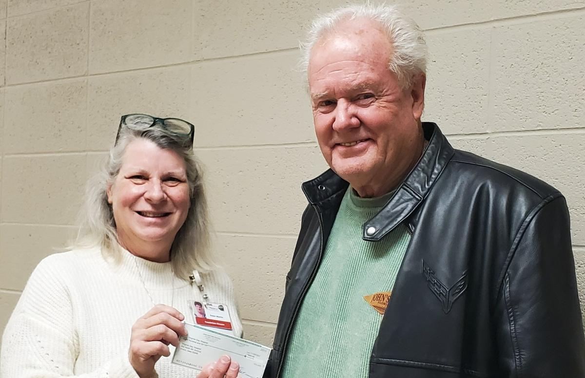 Round-Up for Hope receives donation from JQS customers