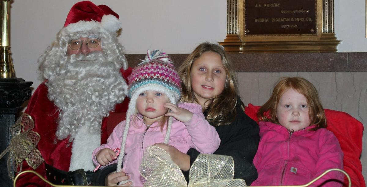 Santa arrives in Vinton and welcomes children at the Benton County Courthouse