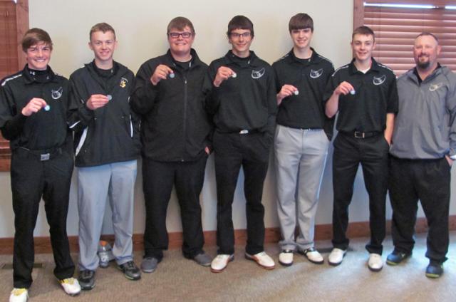 Viking golfers hold their 2nd place medals after the Regional event at West Delaware.
