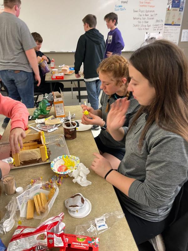 Officers Izzie Birker and Megan Shclittler worked hard on their second place gingerbread house.