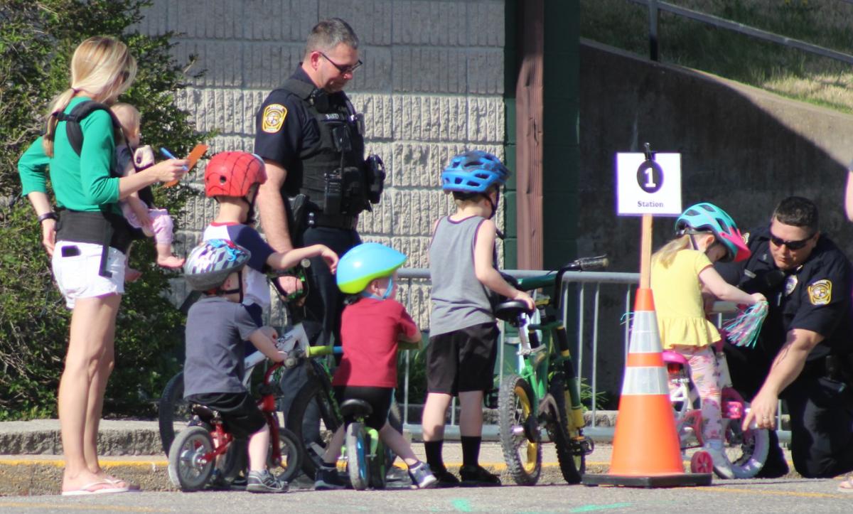 Area children wait their turn at the rodeo to have their bikes checked by the VPD to make sure they are safe and ready to go