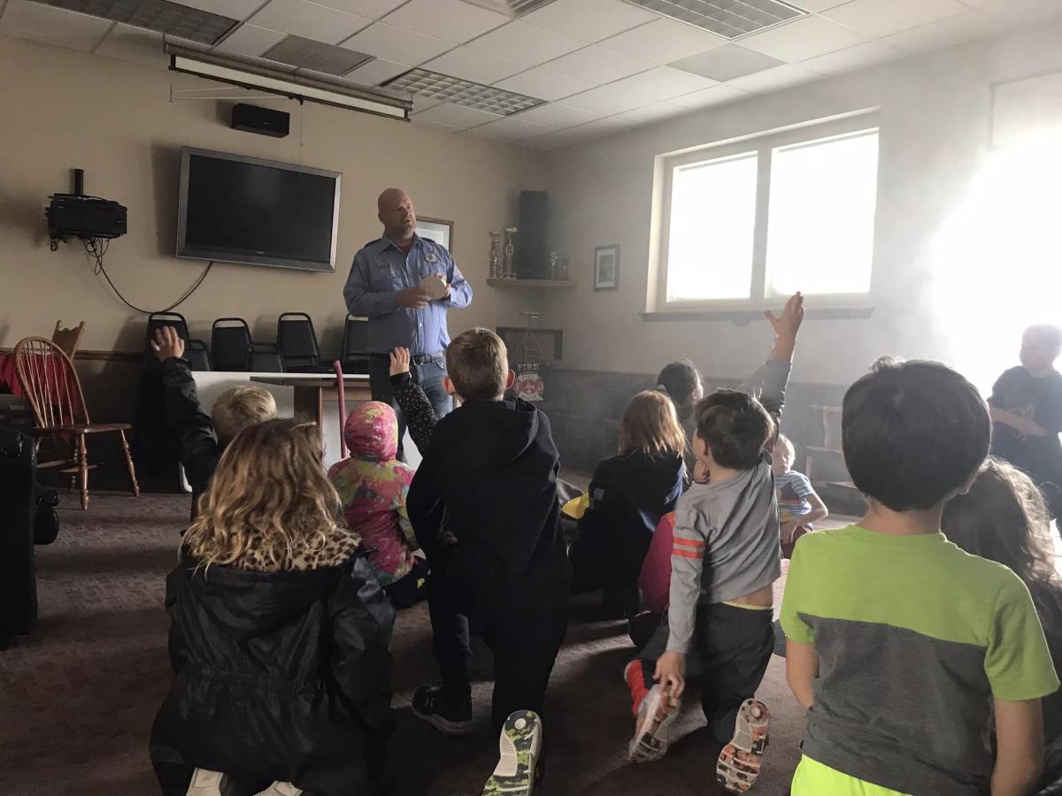 Josh Geiger talks to students of Tilford Elementary about Fire Safety and how to respond when there is smoke in the room