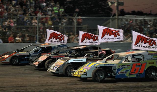 4-wide: Drivers make a lap around the track before the 40-lap Hogan Memorial Race.