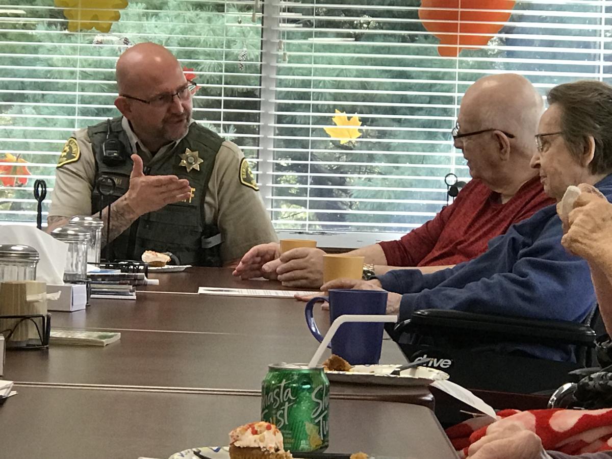 Lee and Marlene Overton talk with Deputy Upah