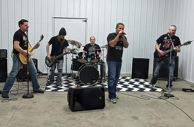 Tim Guenther and other members of 5 Second Rule prepare for 'Battle of the Bands' in Swisher.