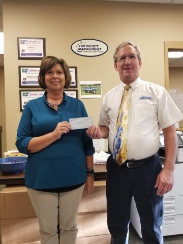 ECIREC CEO Teresa Floyd Presents Scott Hanson of Benton County Disaster Recovery Coalition $20,000