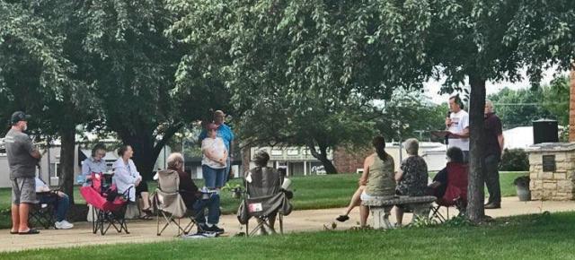 Area residents gathered at 7:14 on July 14 to read the Bible as part of a statewide project