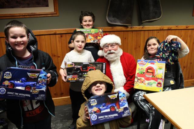 Several area children received gifts from the Kiwanis Division of Santa's Workshop