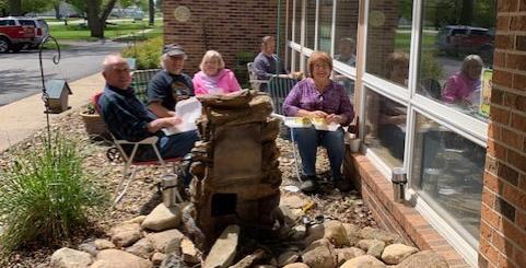 Vinton Lutheran Home hosted family at a drive thru picnic shared by residents inside the building