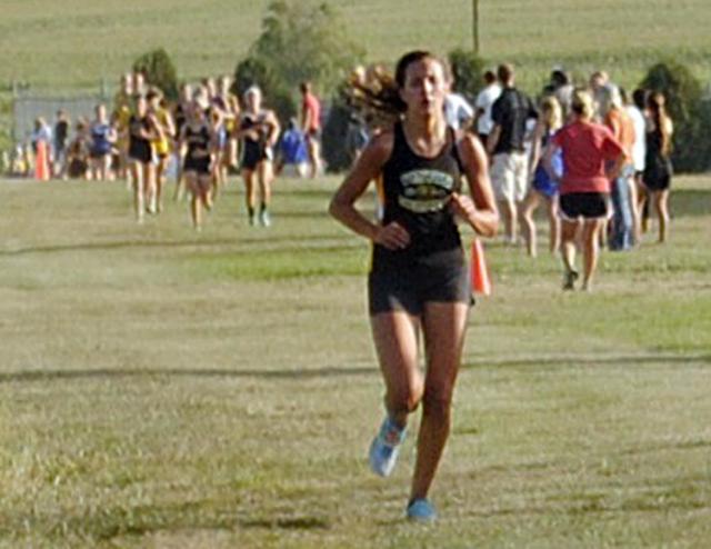 Lily Horst won the girls varsity race, 50 seconds ahead of the second-place runner.