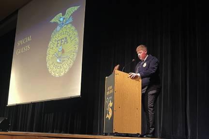 Vinton-Shellsburg FFA President Andrew Pingenot introducing the special guest at Pork BBQ. 