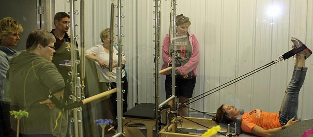 Julie Lessig demonstrates some of the equipment at Total Balance during the VU After Hours.