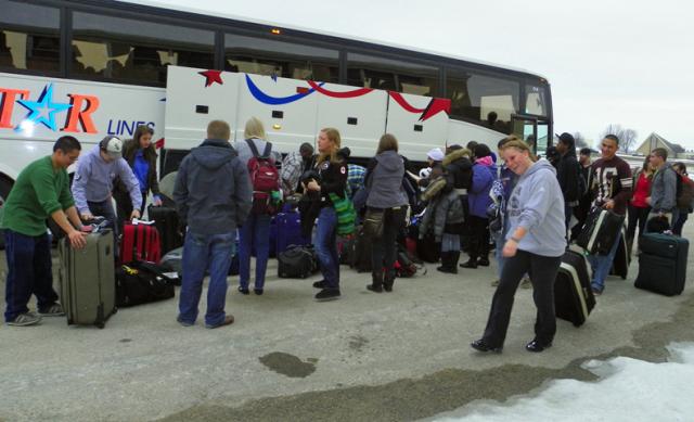 A group of AmeriCorps NCCC members arrives on the bus from the CR Airport Tuesday afternoon.