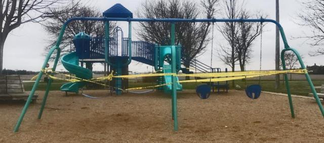 Playgrounds in the area sport yellow police tape as all playground equipment is now off limits