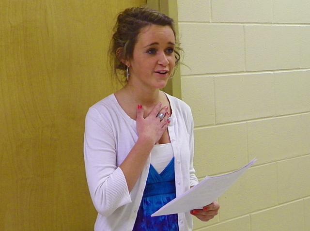 Annie Meyer gestures while she recalls her grandmother's handwriting while reciting her oratory.