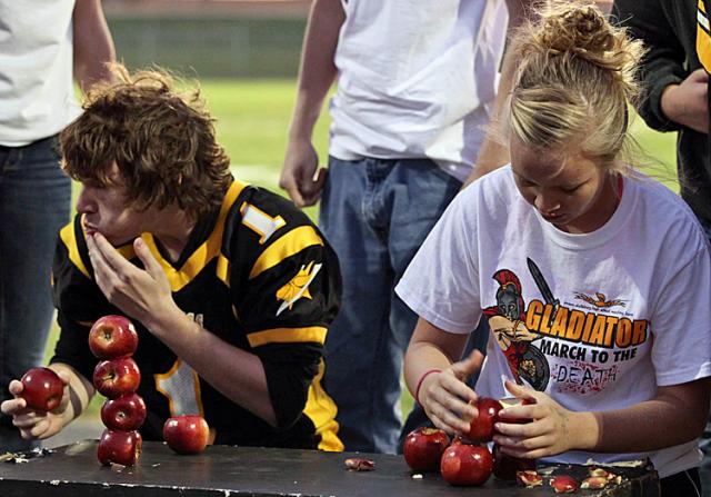 Apple stacking was one of the 'Minute to Win It' events at the Thursday pep rally.