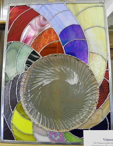 Art Guild helps area family: Dave Morrow's stained glass projects are among silent auction items.