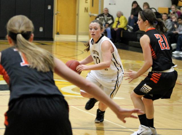Ashley McKenna looks for room to drive to the basket.