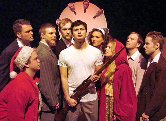 'Assassins:' Erin Horst (standing to the right of the man with rifle) plays the role of Sara Moore.