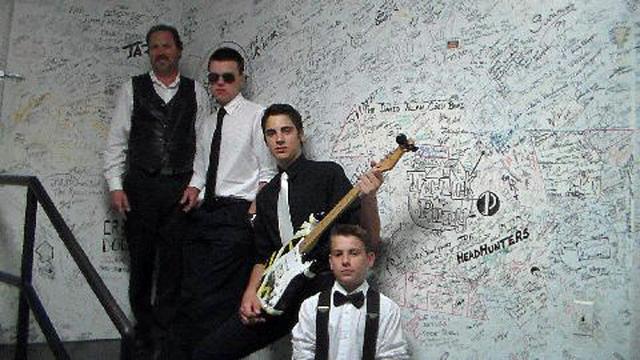 Strait Run: Vic, Stephen, Samuel and Gabe, signed the musicians' wall at the Surf Ballroom.