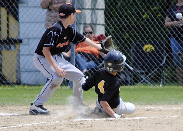 Austin Bohnsack scores on a passed ball.