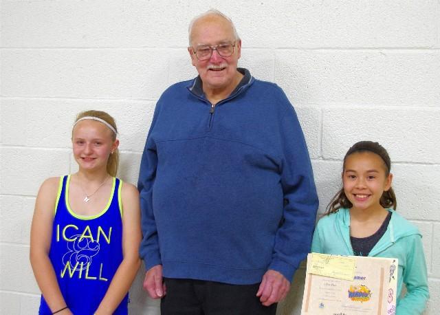 Second Place Winner Hanna Hansen, Commissioner Harold Cassens, and First Place Winner Shakayla Lamer
