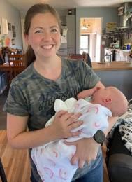Bethany Gates with one of the babies she's helped to deliver, is hoping that the state will make licensing available to Iowa midwives