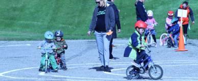 Little bikers take to the course as they try to stay between the lines