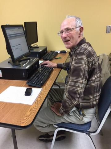 Bill at the computer completing a training module