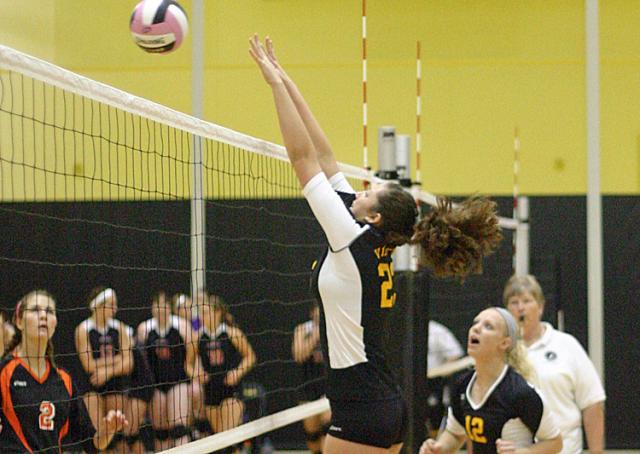 Haley Bird (23) knocks down a big block against Waukon. (Photos by Jeff Holmes)