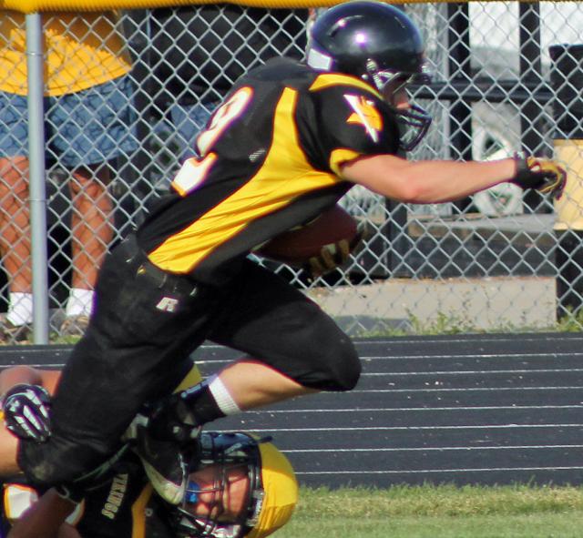 A defender brings down a Viking runner.