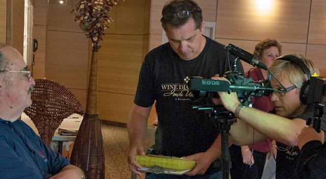 Brad Johnson and Kirk Monson interview a vineyard owner for an upcoming documentary.