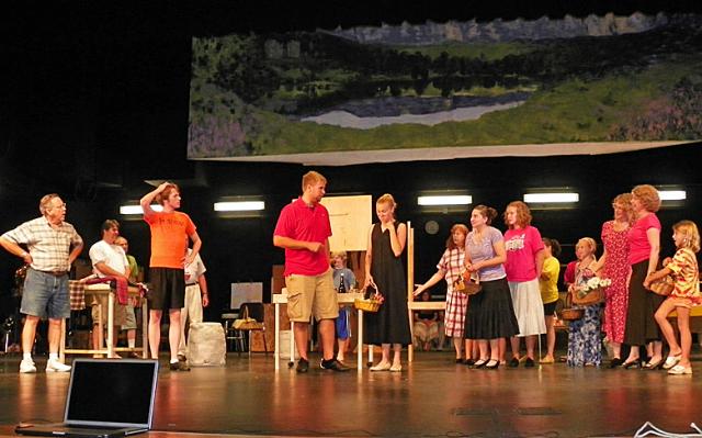 The villagers welcome the Americans to town in 'Brigadoon.'