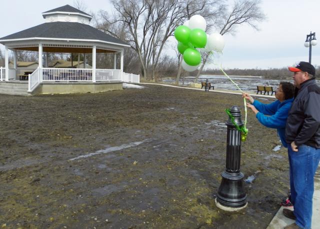 Jackie and Tom Donnelly left balloons at Celebration Park in Memory of Burns Mossman today.
