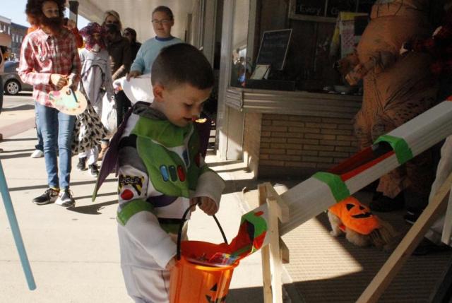 A socially distant halloween candy dispenser was one of the creative delivery methods for treats