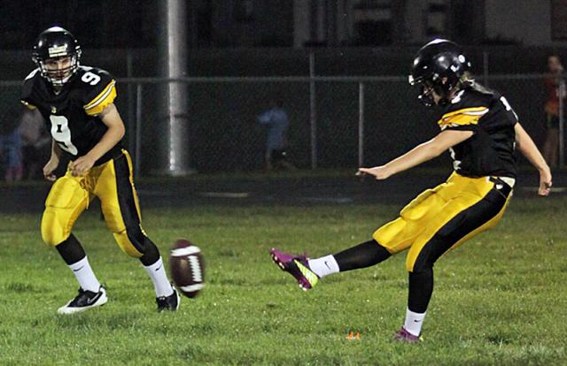 Kelly Wagner kicks off for the Vikings after a second half touchdown.