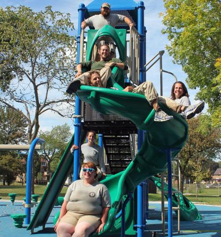 Cedar 2 poses on new playground equipment at one of the Boys & Girls Clubs of Greater Milwaukee.