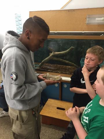 NCCC member Calen of Cedar 4 showcases one of the many reptiles The Headwaters Science Center.