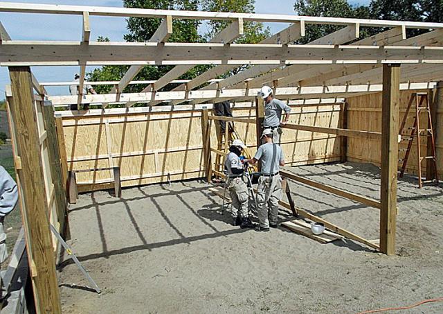 Amanda, Zach and Allison are working on bracing the roof of the warming hut.