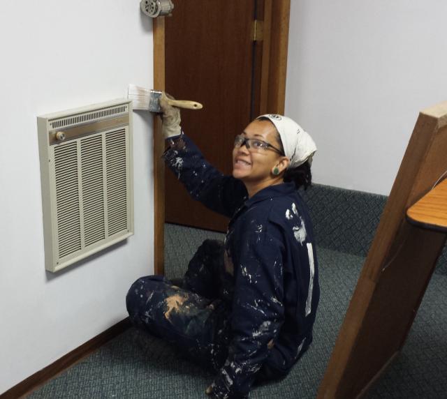 Cedar 7 member Kyla Russell assisting in painting the Education Center at the Nebraska State 4H Camp