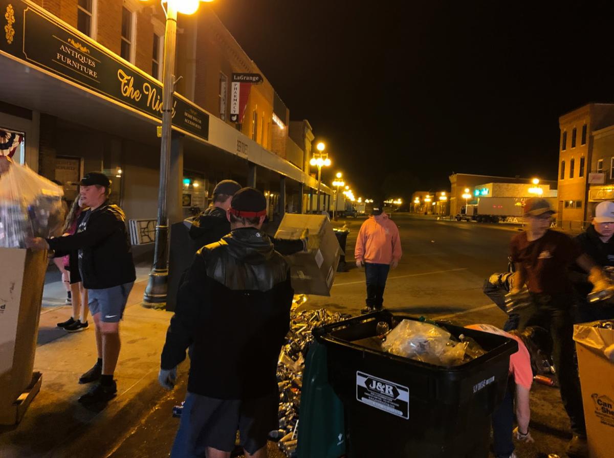 FFA members sorting out the cans from the trash bins.