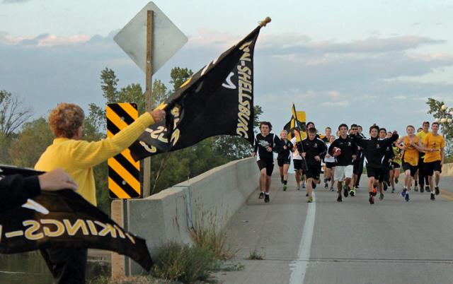 Homecoming tradition for 25 years: VS cross country team ran the ball from Independence to Vinton.