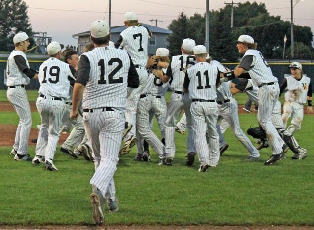 Vikings celebrate the final out of their Sub-State victory at Williamsburg. They play in DM Tuesday.